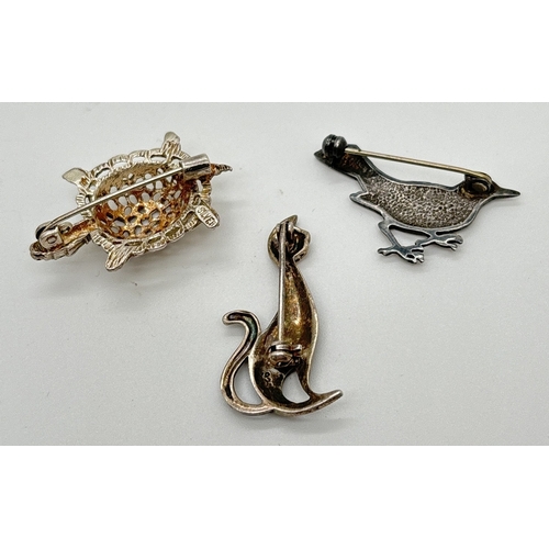 1065 - 3 silver animal and bird brooches. A pierced work turtle with small ruby set eyes, a small silver bi... 