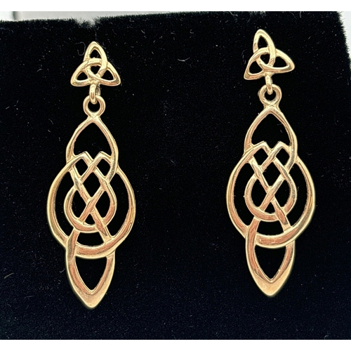 1005 - A pair of 9ct gold Celtic knot drop style earrings with trinity knot posts. Hallmarked on posts, app... 