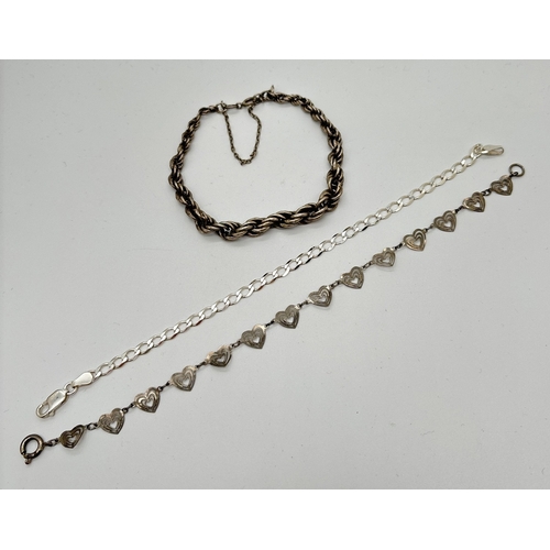 1071 - 3 silver bracelets. A rope chain bracelet with safety chain, a heart link bracelet and a curb chain ... 