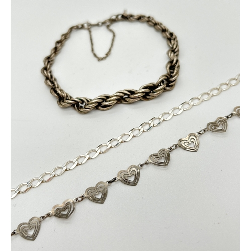 1071 - 3 silver bracelets. A rope chain bracelet with safety chain, a heart link bracelet and a curb chain ... 