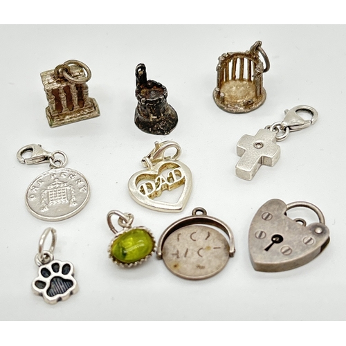 1075 - 9 vintage and modern silver & white metal charms with a silver padlock. Charms include a Hot Diamond... 