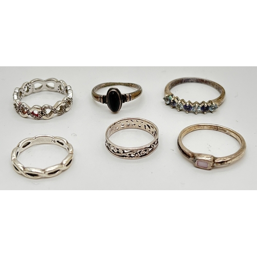 1078 - 6 silver modern design rings, mostly band style. To include infinity knot ring set with clear stones... 