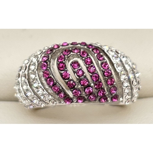 1094 - A rhodium plated dome style cocktail ring set with red and clear Swarovski crystals. 3 rows of red c... 