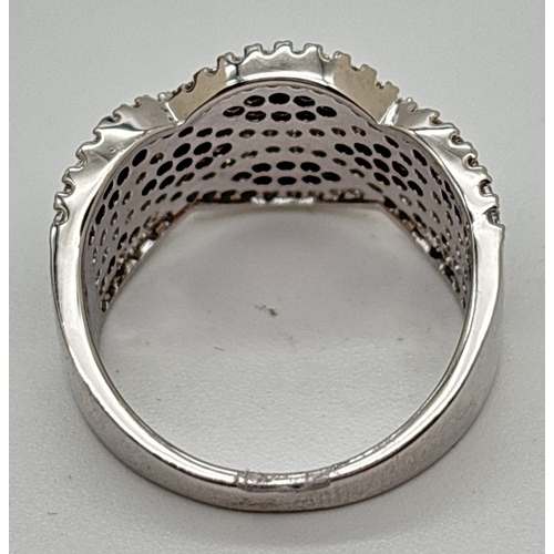 1097 - A rhodium plated cocktail ring set with Swarovski crystals in a crossover twist style 2 row design. ... 