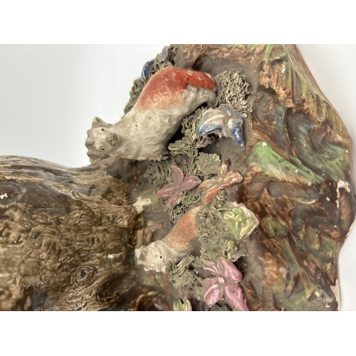 1227 - A 19th century large Staffordshire pottery animal figure group. Figures of 4 sheep and a deer sat wi... 