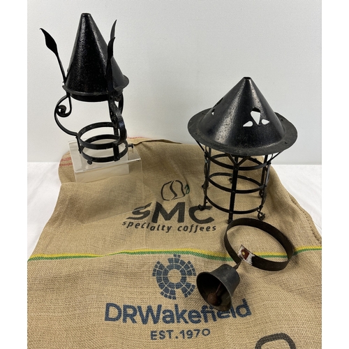 1189 - 2 vintage black metal lanterns together with an antique shops bell & a hessian advertising sack for ... 