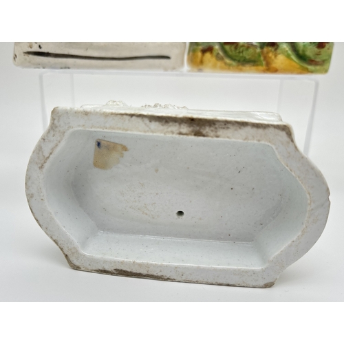 1229 - 3 Staffordshire 19th century figures. A sponge finished black and white horse spill vase, a flat bac... 