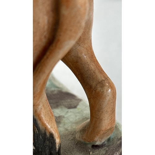 1236 - A collection of antique ceramic figures. To include Staffordshire Lion, Chelsea ginger and white cat... 