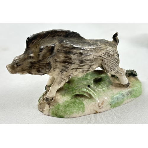 1236 - A collection of antique ceramic figures. To include Staffordshire Lion, Chelsea ginger and white cat... 