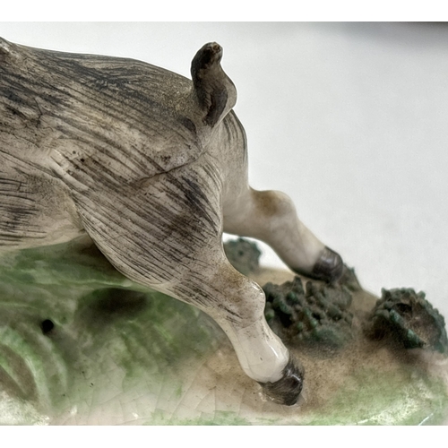 1236 - A collection of antique ceramic figures. To include Staffordshire Lion, Chelsea ginger and white cat... 