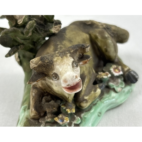 1236 - A collection of antique ceramic figures. To include Staffordshire Lion, Chelsea ginger and white cat... 