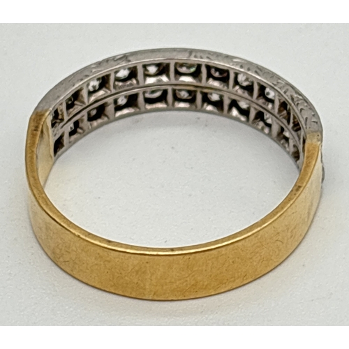 1001 - An 18ct gold and diamond double row half eternity style ring. 24 round cut diamonds totalling approx... 