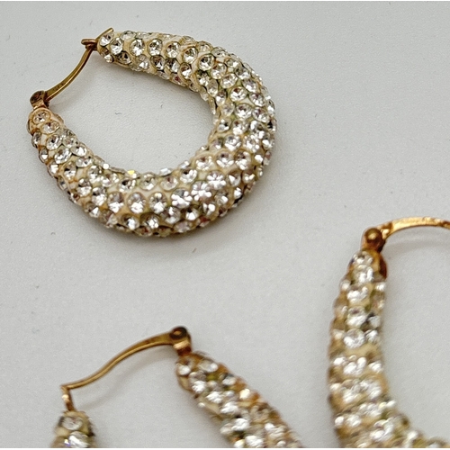 1109 - A pair of 9ct gold disco ball style hoop earrings, set with small round clear crystals. Together wit... 