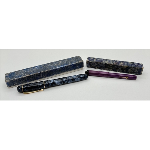 1187 - 2 boxed vintage 1930's lever filled fountain pens. The 'Nova' pen with blue marbled case and lid, na... 