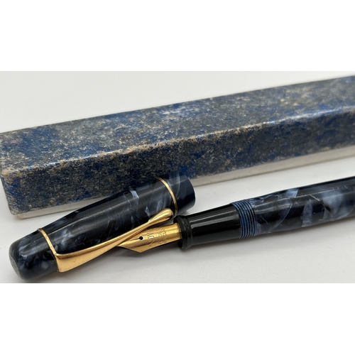 1187 - 2 boxed vintage 1930's lever filled fountain pens. The 'Nova' pen with blue marbled case and lid, na... 