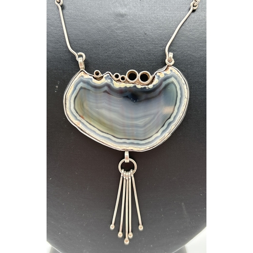 1011 - A contemporary design natural agate fixed pendant necklace with spring ring clasp. Bezel set blue ag... 