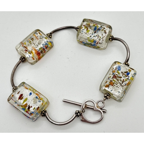 1024 - A modern design square foil glass bead and curved silver link bracelet with T-bar and heart shaped c... 