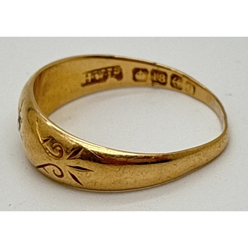 1062 - A vintage 18ct gold gypsy style band ring with engraved decoration and single round cut diamond. Ful... 