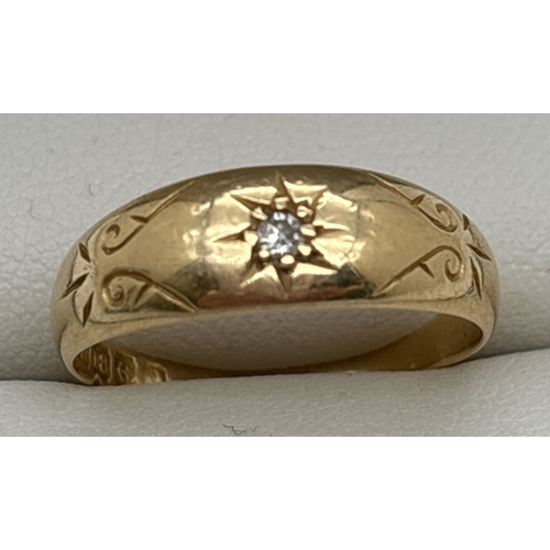 1062 - A vintage 18ct gold gypsy style band ring with engraved decoration and single round cut diamond. Ful... 