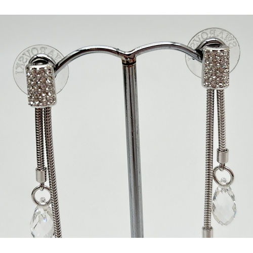 1088 - 2 pairs of crystal drop earrings. A pair of Swarovski silver tone double drop earrings with 2 facete... 