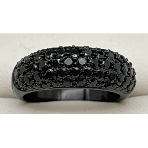 1090 - A Swarovski black dome style cocktail ring set with 5 rows of black round cut crystals. Ring size N½... 