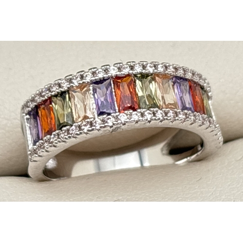 1091 - A rhodium plated cocktail band ring set with Swarovski crystals. Half eternity style ring set with y... 