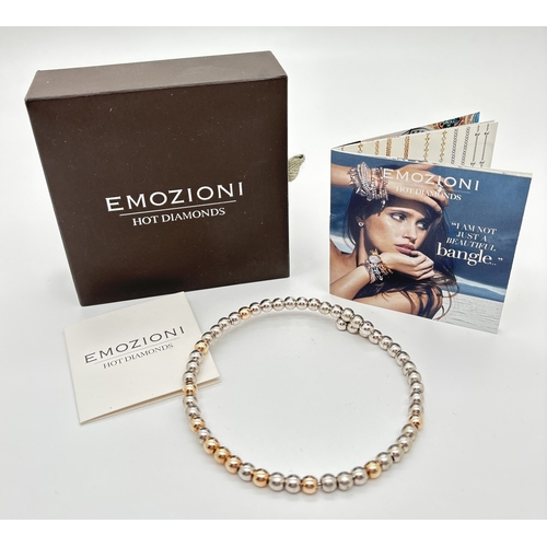 1116 - A boxed Emozioni Hot Diamonds silver and gold plated round bead wrap bracelet. Complete with booklet... 