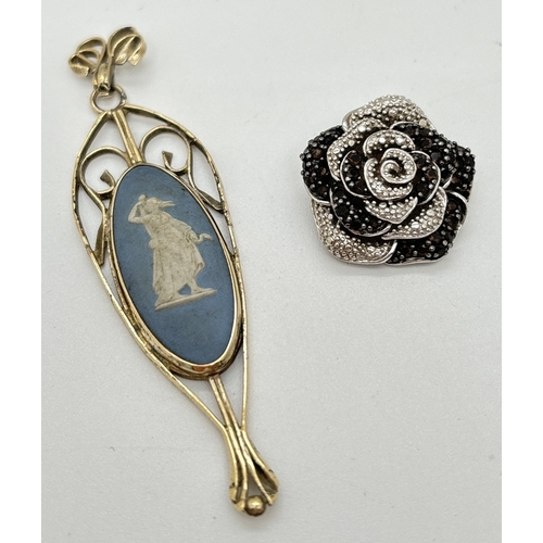 1135 - 2 silver pendants. A vintage silver gilt drop pendant set with a blue Wedgwood jasperware panel, tog... 