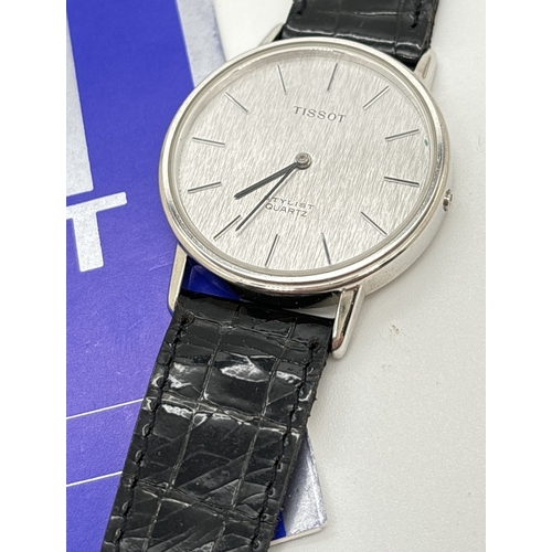 1164 - A men's Tissot Quartz 2032 wristwatch with patent strap, original tag and instruction booklet. Silve... 