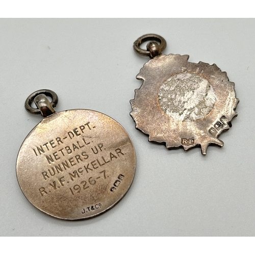 1168 - 2 vintage silver medals, both with enameled decoration. A Netball medal engraved 