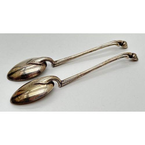 1169 - A pair of antique Art Nouveau style white metal teaspoons with deer hoof finials. Unmarked, possibly... 