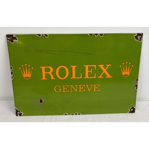 1191 - A small rectangular shaped enamelled metal wall advertising sign for Rolex. Approx. 20cm x 30cm.