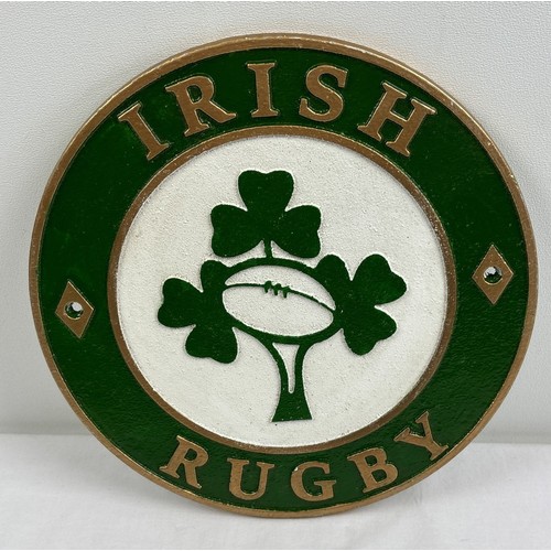 1200 - A painted circular shaped cast iron Irish Rugby wall plaque. With holes for fixing. Approx. 24cm dia... 