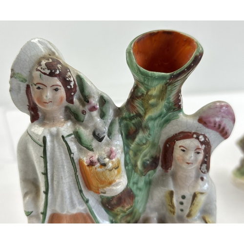 1235 - A collection of 5 Staffordshire figures, spill vases and flat back figures, to include a young boy a... 