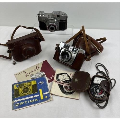 1305 - 2 vintage cased cameras together with a Western Master III universal exposure meter in original case... 