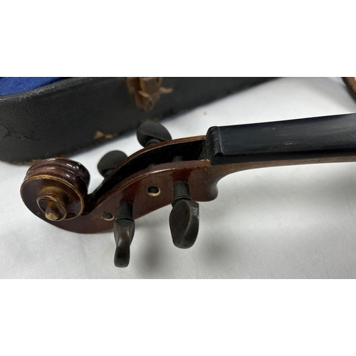 1307 - A vintage 3/4 child's violin with bow in original carry case. No strings but case contains chin rest... 