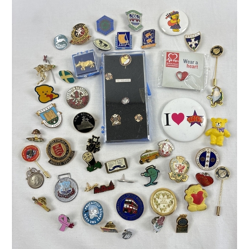 1314 - A collection of vintage enameled and modern pin badges. To include 1960's Butlins, Wembley Speedway,... 