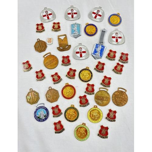 1317 - A collection of vintage enameled and brass finish medallions. To include St, Christophers, Northern ... 