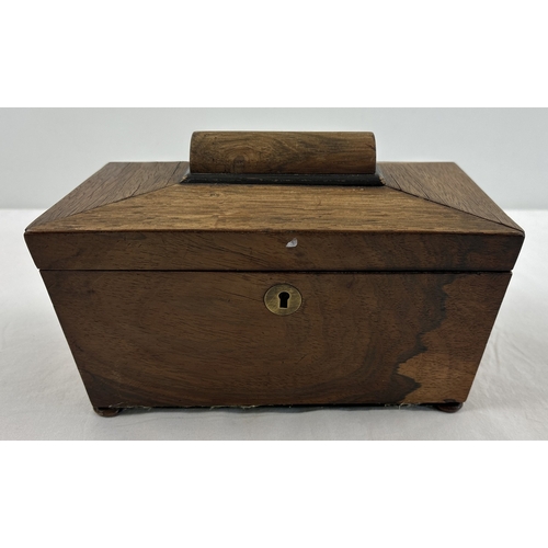 1318 - A vintage sarcophagus shaped wooden tea caddy with 2 interior compartments, paper lined with lift up... 