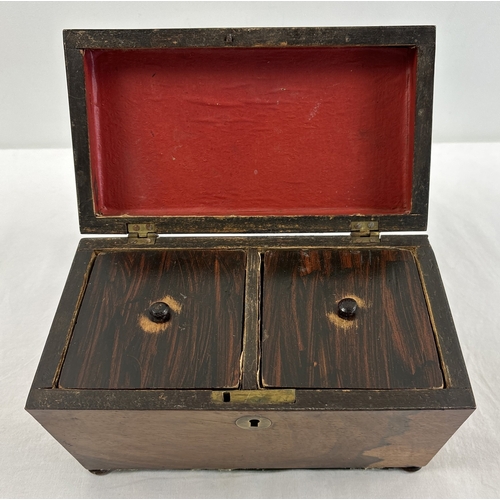 1318 - A vintage sarcophagus shaped wooden tea caddy with 2 interior compartments, paper lined with lift up... 