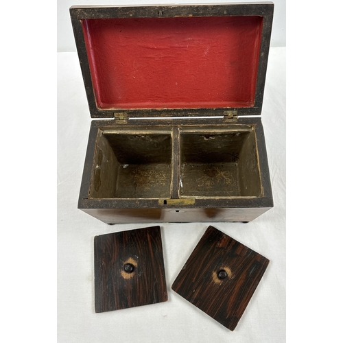 1318 - A vintage sarcophagus shaped wooden tea caddy with 2 interior compartments, paper lined with lift up... 