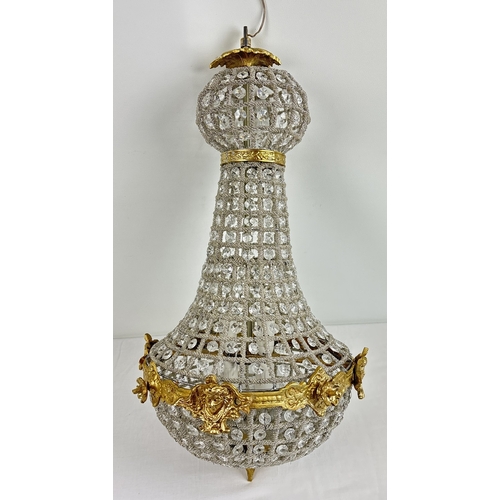 1340 - A heavily beaded, Empire style ceiling chandelier. Cut glass and intertwining beads decorated with b... 