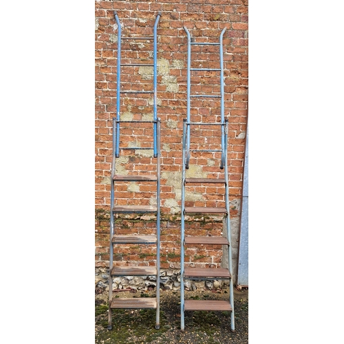 1400 - 2 metal framed combination step ladders with metal bar and wood plank steps. Item not on site, viewi... 