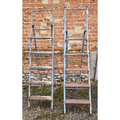 1400 - 2 metal framed combination step ladders with metal bar and wood plank steps. Item not on site, viewi... 