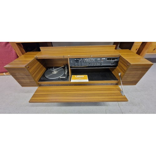 1423 - A retro 1970's stereogram by Ultra, with cassette player,  record deck and built in speakers. Comes ... 