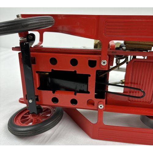 A Mamod FE1 steam powered model fire engine, unboxed, with red