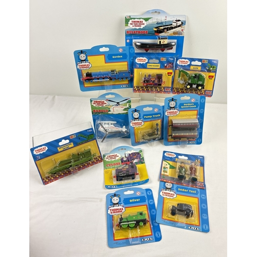 12 assorted Ertl Thomas the Tank Engine carded diecast engines, vehicles and accessories, all unopened. To include Gordon, Gordon's special coaches, Lord Harry, Harold the helicopter, Sodor Taxi, Culdee, Oliver and Pump Truck (plastic pealing from card in one area).