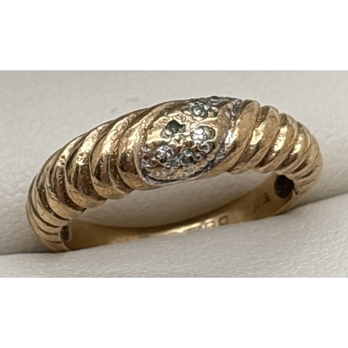 1032 - A vintage 9ct gold twist design dome style ring set with 5 small diamonds. Fully hallmarked inside b... 