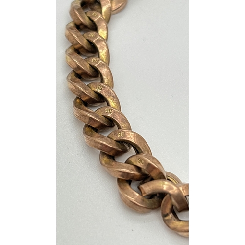 1046 - A vintage 9ct gold curb chain bracelet with heart shaped padlock clasp. Has remains of a safety chai... 