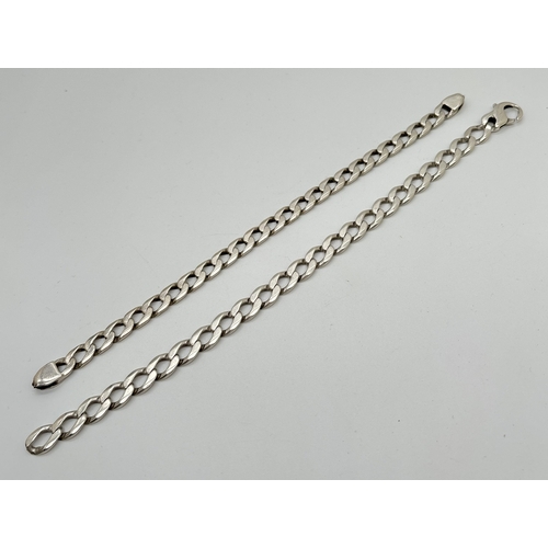 1068 - 2 heavy white metal curb chain bracelets, for scrap or repair. One with worn marks to fixing. 8.5